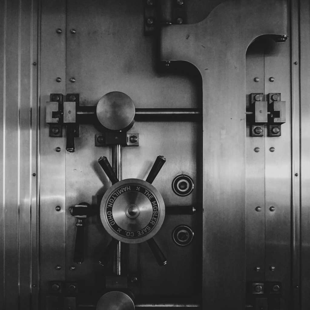 a black and white image of a bank vault, demonstrating that a bank loan can be an option for medical practice financing